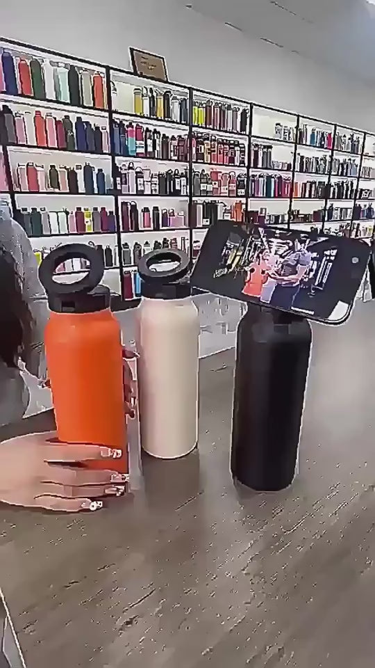 magsafe bottle gym. Three water bottles in white, blue, and yellow on a gray background with text about dimensions and color options.